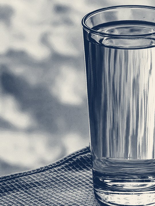 A glass of clear drinking water, advertising a free in-home water test by Jones Air & Water