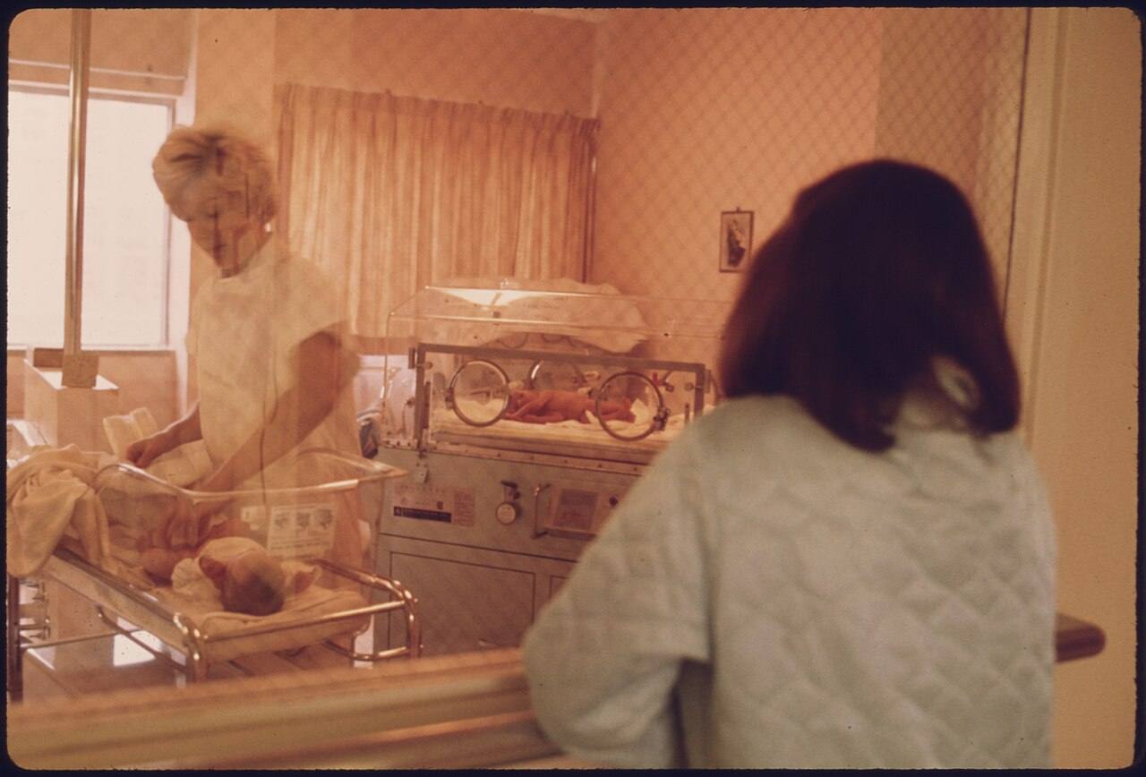 A New Mother Views Her Child in the Nursery of Loretto Hospital in New Ulm, Minnesota. There Are Two Hospitals in The...