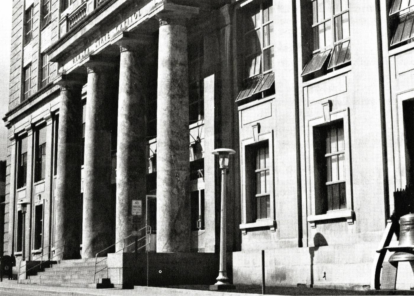 View from Fourth Street of the front entrance and marble columns of the Alaska State Capitol as it appeared in the early-mid 1970s.