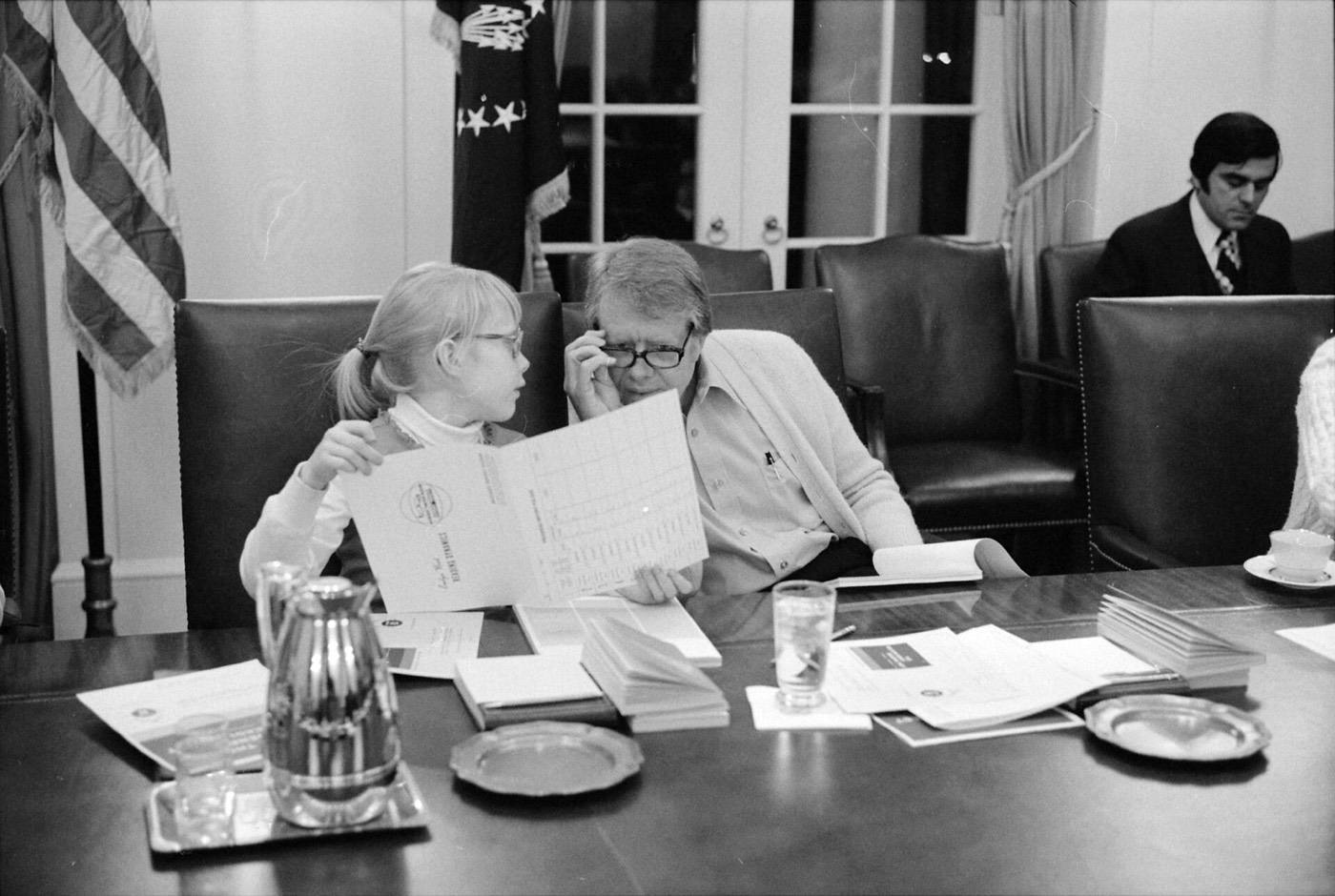 Amy Carter and Jimmy Carter participate in a speed reading course at the White House.