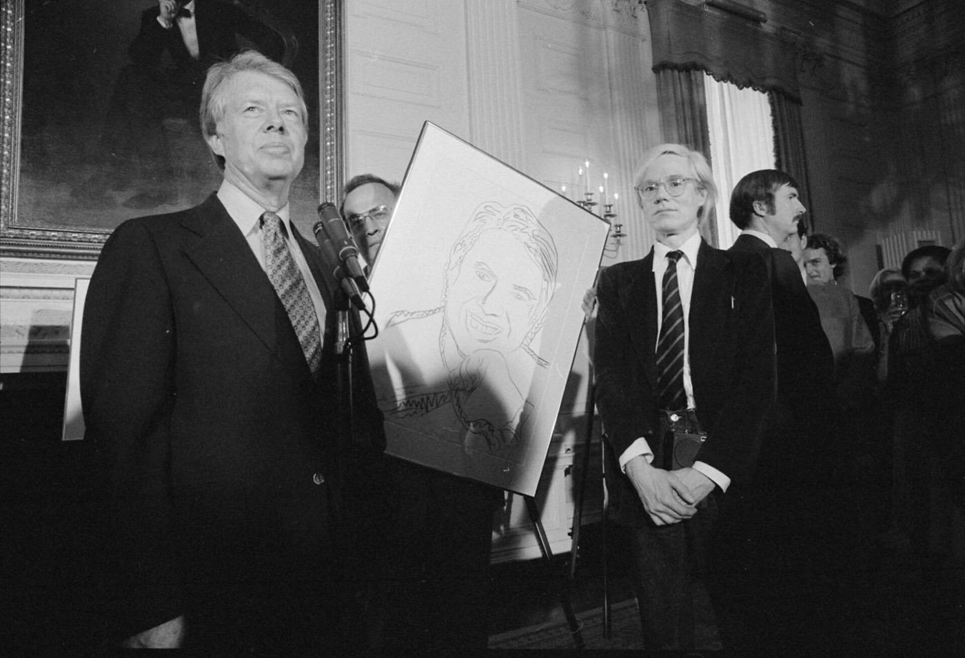 Jimmy Carter with Andy Warhol during a reception for inaugural portfolio artists., 06-14-1977