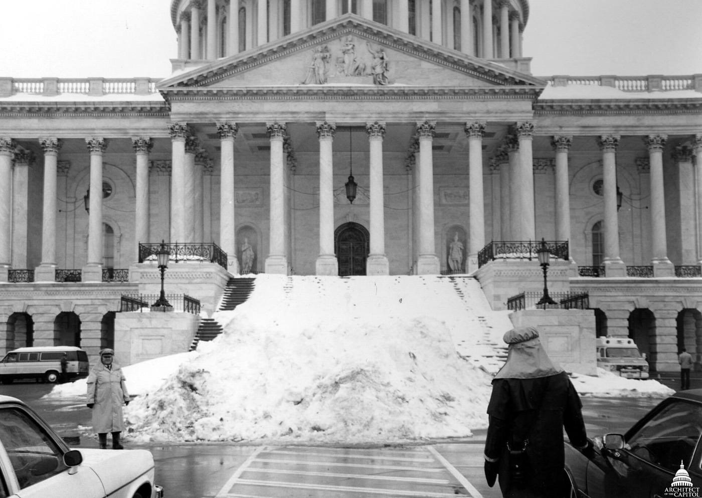 A Capitol Police Officer stands in front of a pile of snow outside Capitol, taken February 21, 1979.