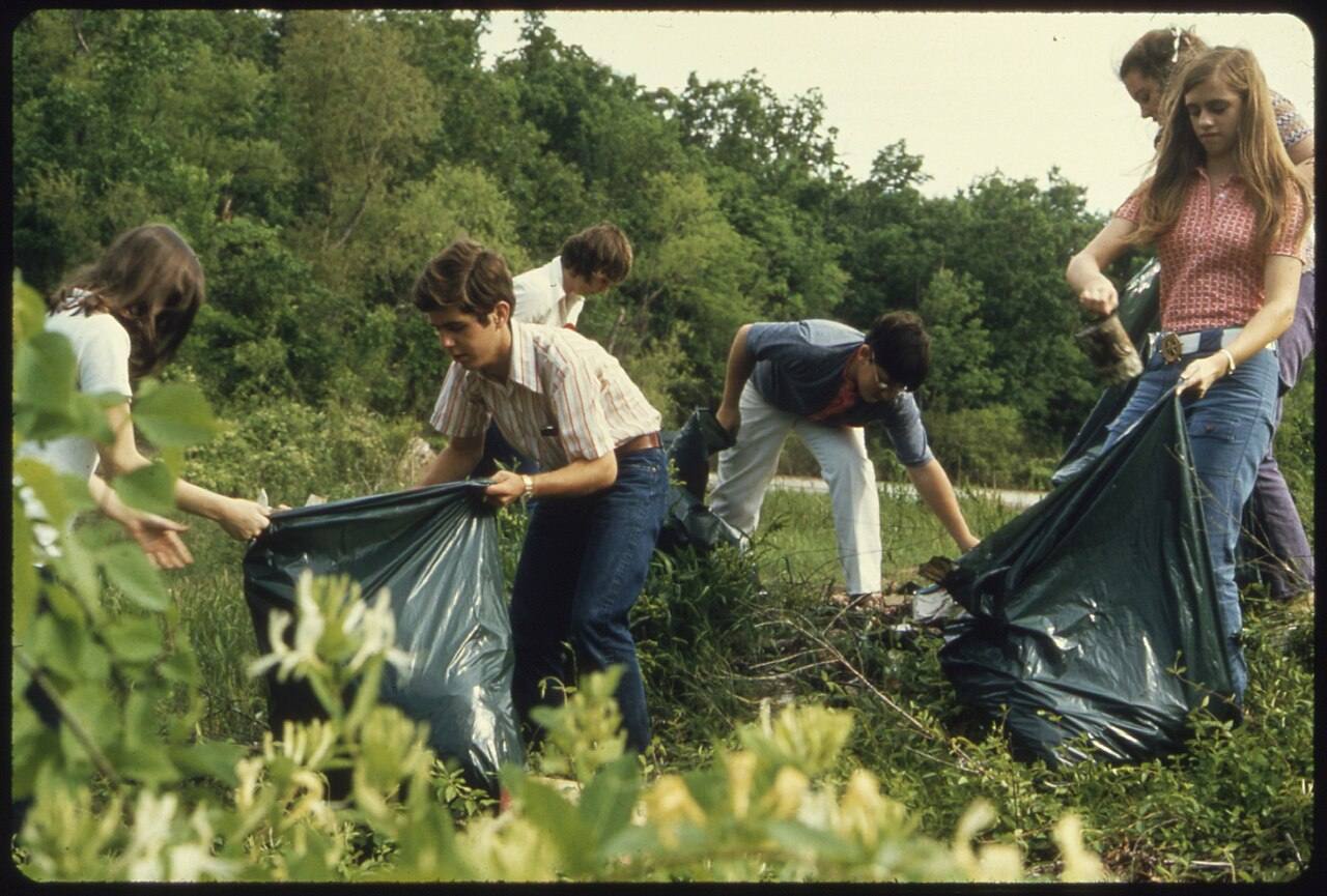 Young People Filling Bags with Litter. ( ..
