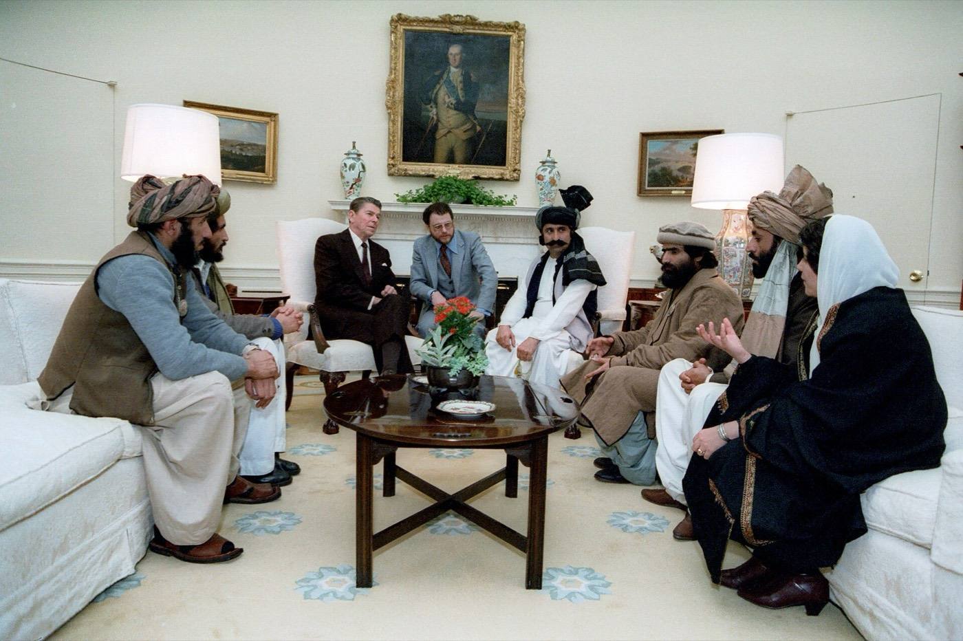 President Ronald Reagan Meeting with Afghan Freedom Fighters in The Oval Office to Discuss Soviet Atrocities in Afghanistan