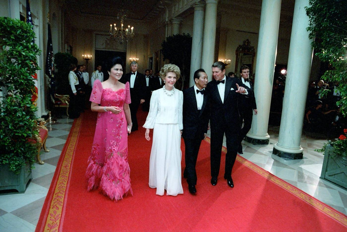 President Ronald Reagan Nancy Reagan Imelda Marcos and Ferdinand Marcos in Cross Hall During a State Dinner for President Ferdinand Marcos of The Philippines