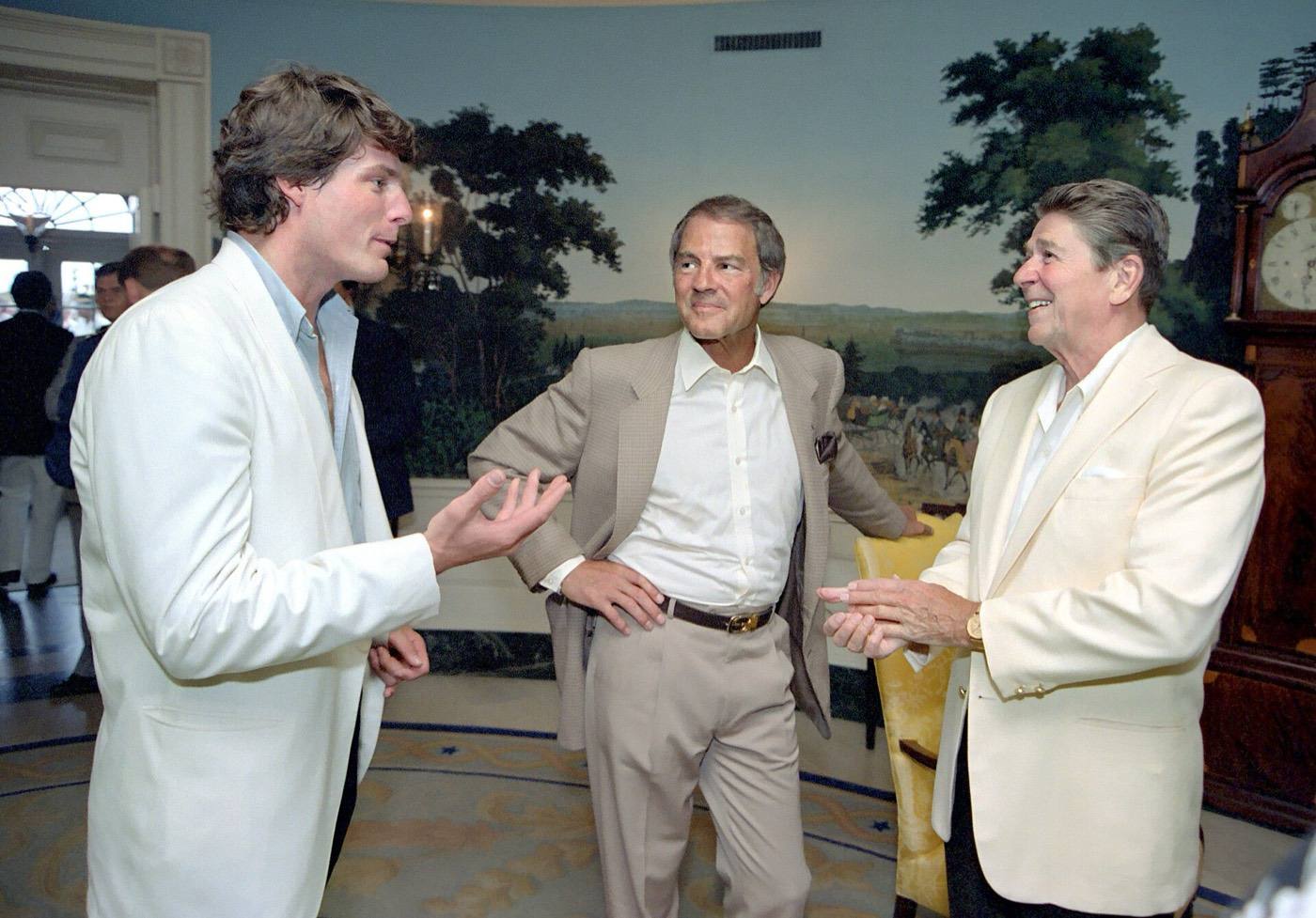 President Reagan talking with Christopher Reeve and Frank Gifford during a reception and picnic in honor of the 15th Anniversary of the Special Olympics program