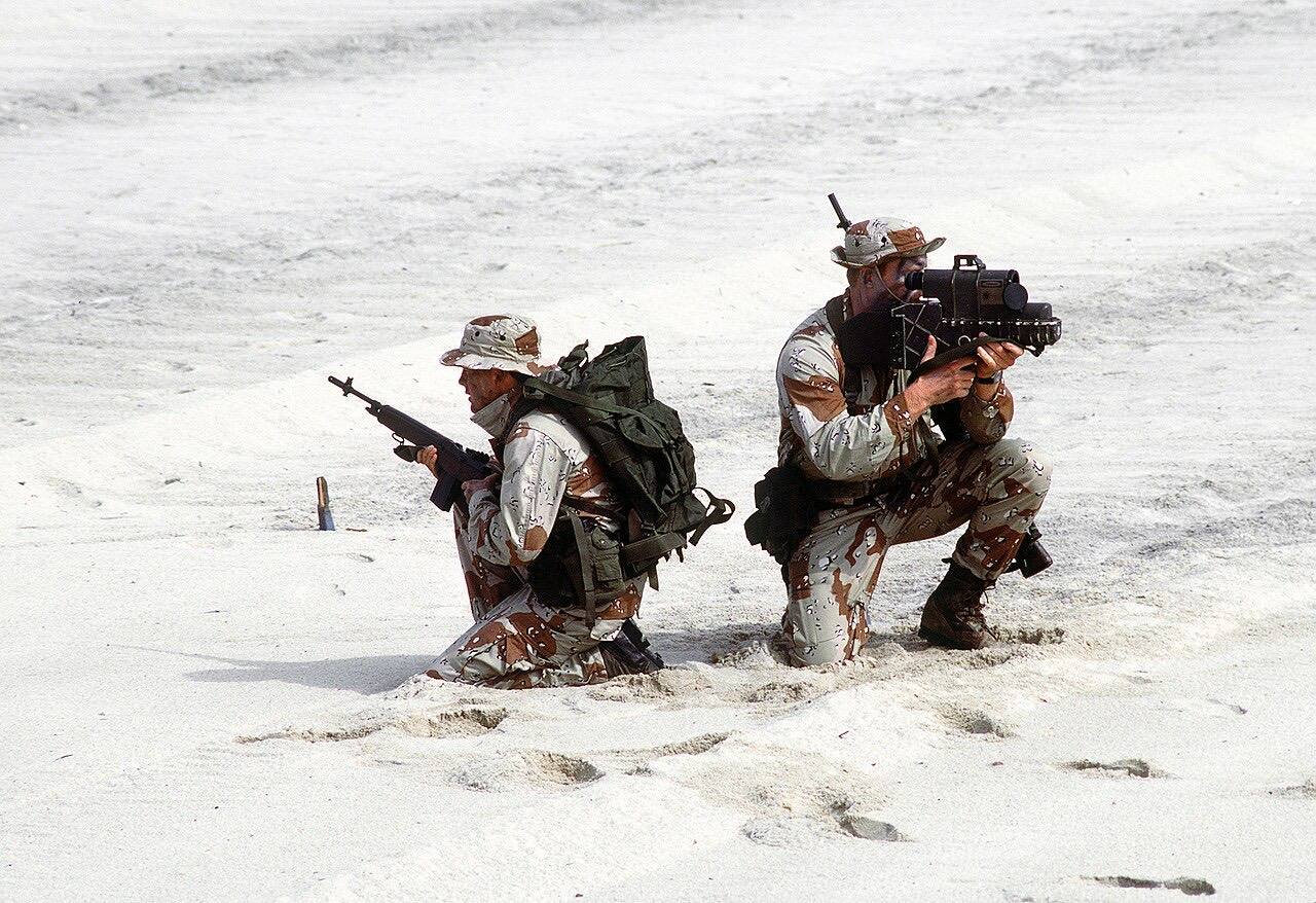 US Navy SEALs with laser designator