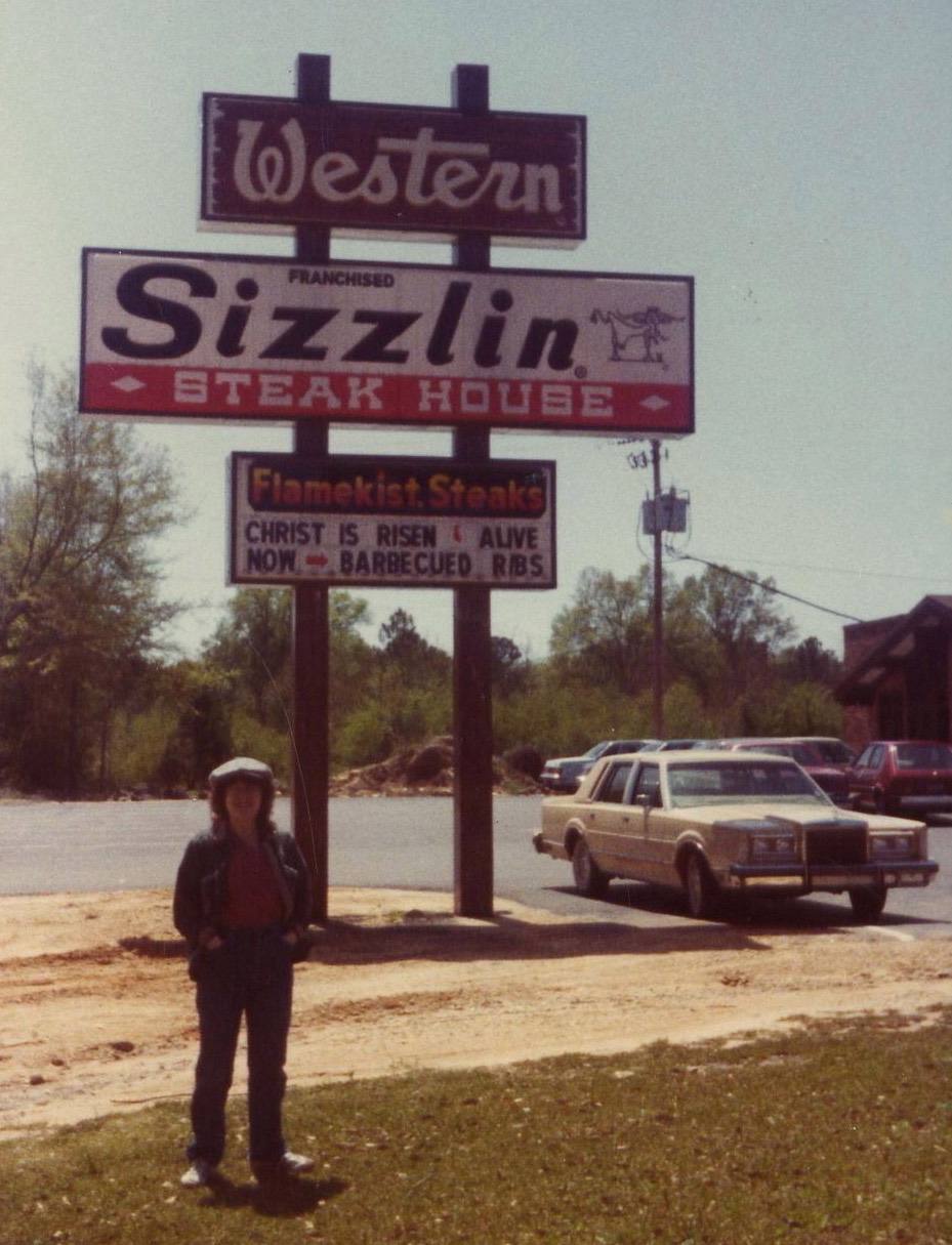 Washington Parish, Louisiana, Easter season, 1983. Restaurant sign has message about Christ and BBQ ribs.