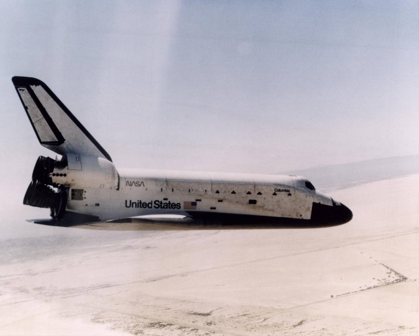 FIRST SHUTTLE LANDING -- The Space Shuttle Columbia glides down over Rogers Dry Lake as it heads for a landing at Edwards Air Force Base at the conclusion of it