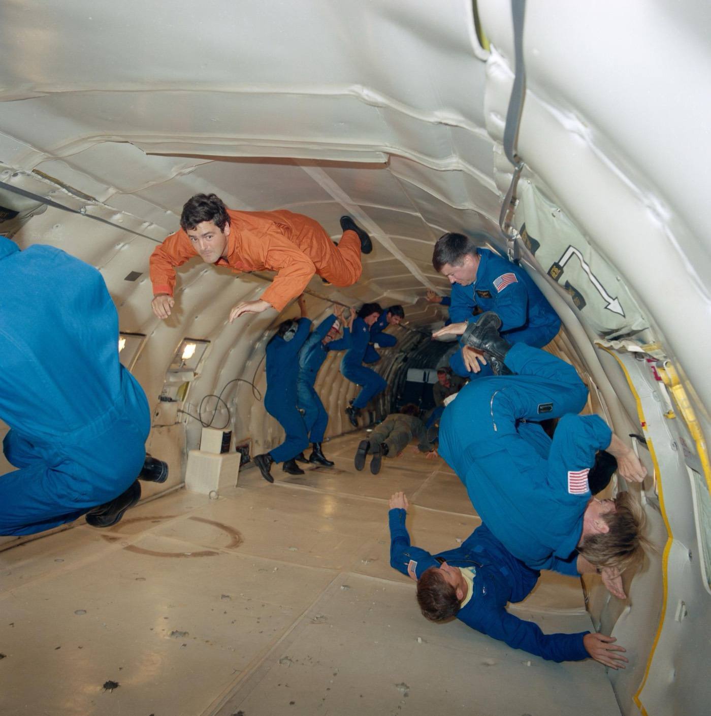 View of astronaut candidates and payload specialists during a training flight on the KC-135. The trainees are experiencing weightlessness in the hold of the air