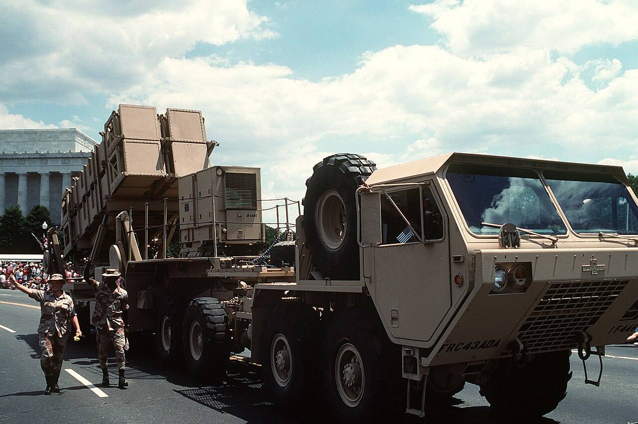 A MIM-104 Patriot tactical air defense missile system is towed by a heavy expanded mobility tactical truck in the National Victory Celebration parade honoring t