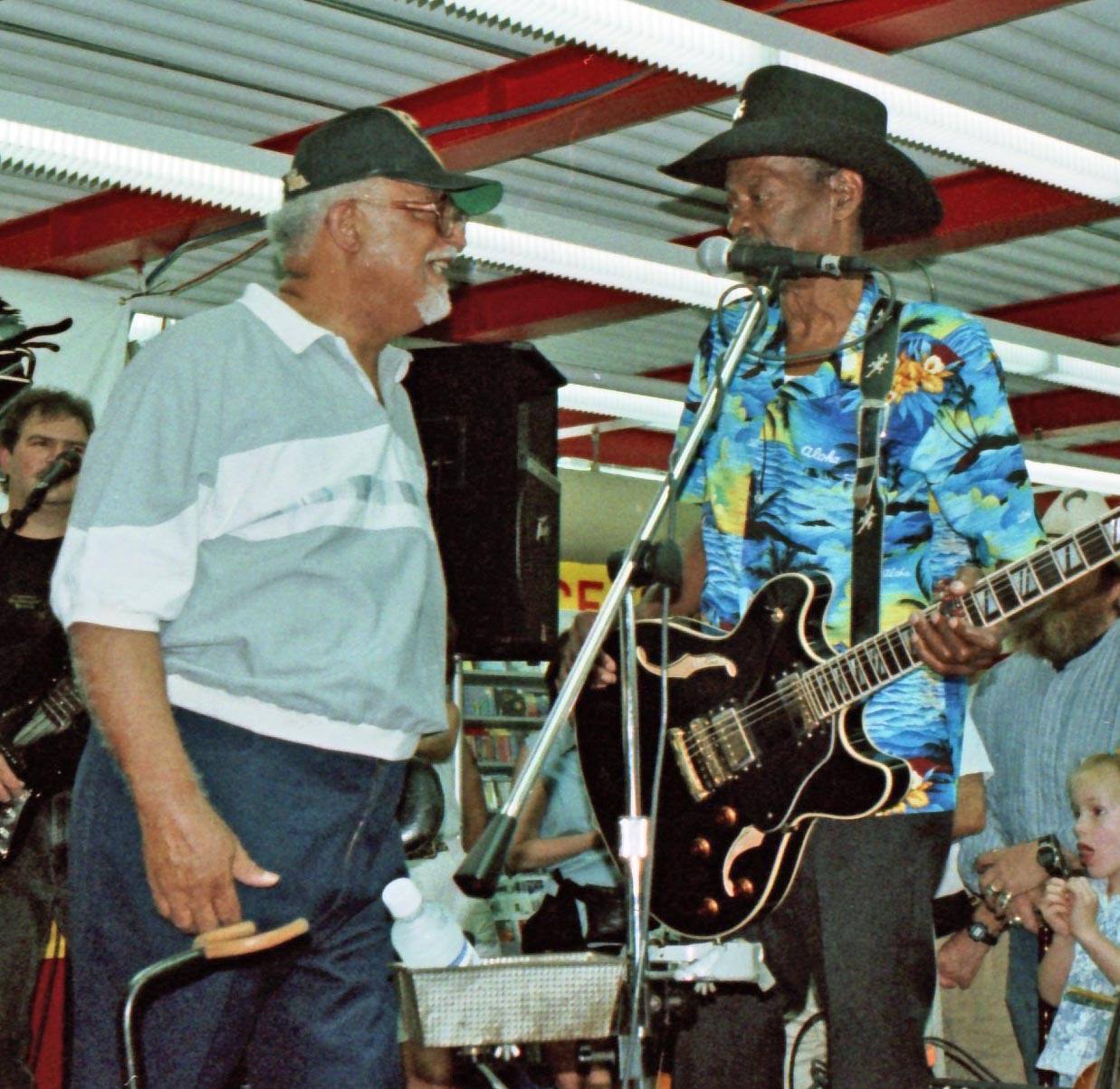 Wardell Quezergue (left) greets Gatemouth Brown at Tower Records, New Orleans, 1997