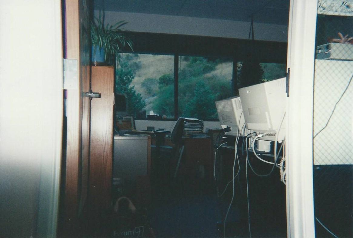 The interior of an office at the Santa Cruz Operation main buildings on Encinal Street in Santa Cruz, California. The hills of the Pogonip area can be seen outs