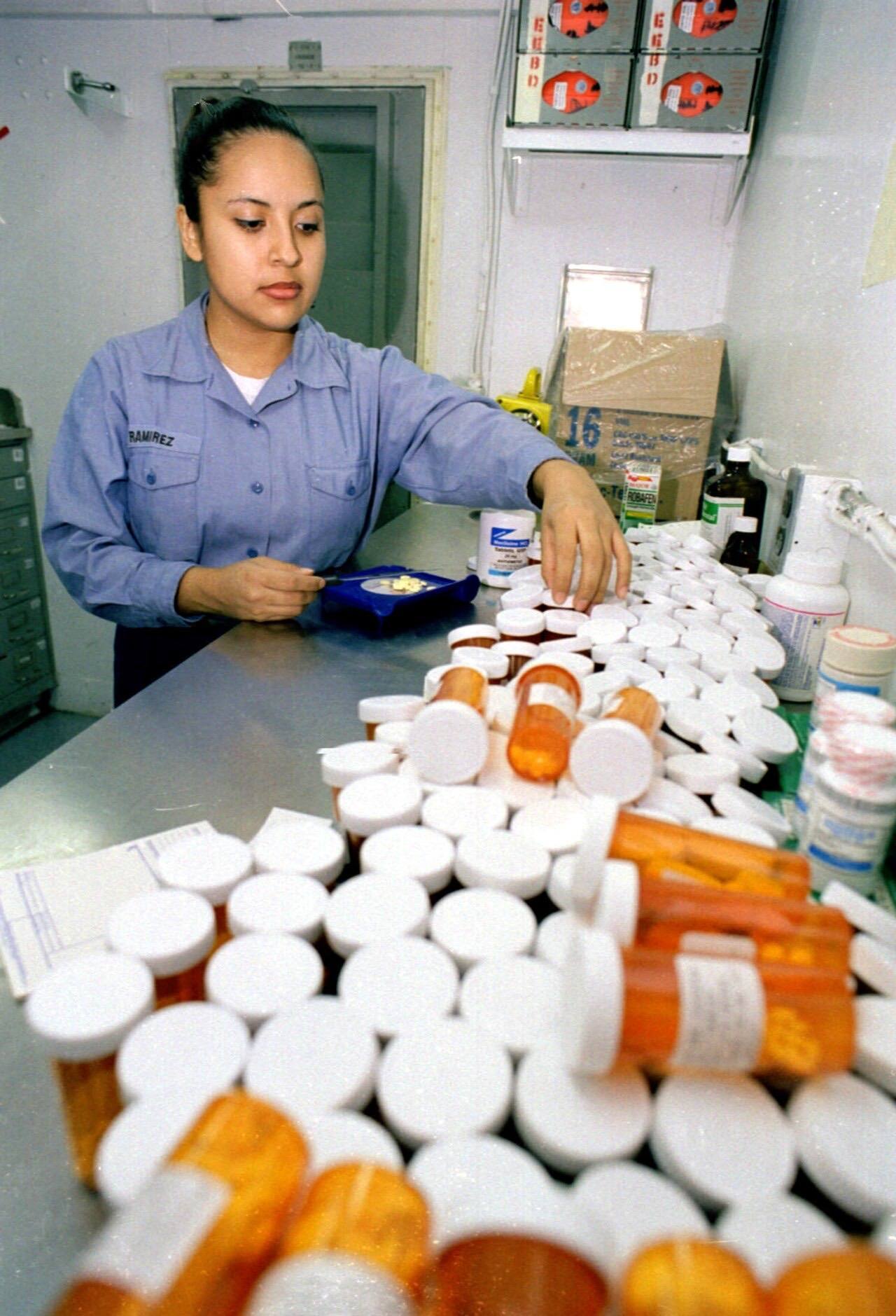 US Navy 990523-N-8493H-001 Corpsman prepares prescriptions for USS Roosevelt crew