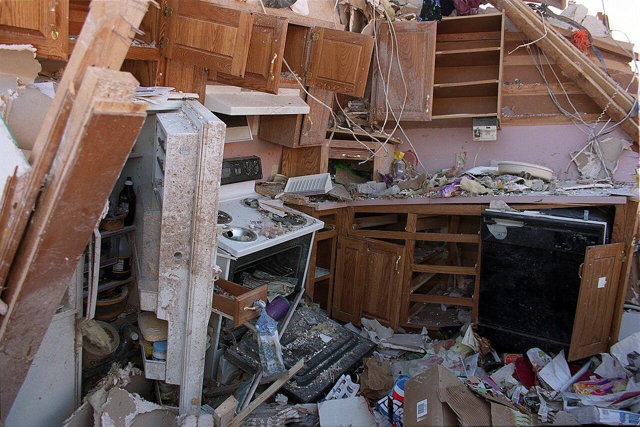 Oklahoma City, Ok, May 1999 -- The kitchen of a home destroyed by the tornado is filled with debris. Photo by Andrea Booher/FEMA News Photo