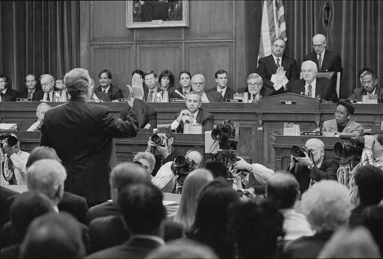 Independent counsel Ken Starr being sworn in prior to testifying about his investigation of President Clinton's relationship with Monica LewinskyLikely in the R