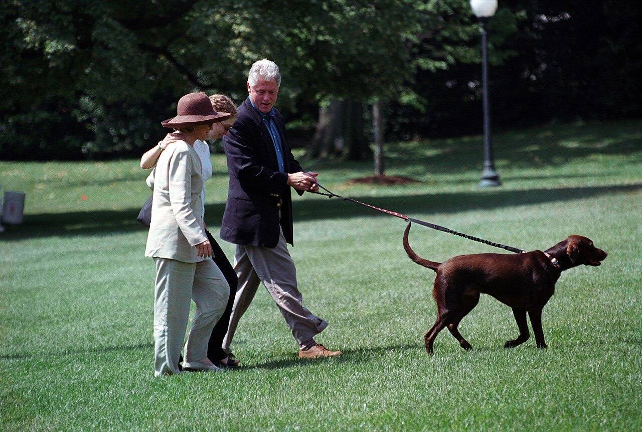 Photograph of President William Jefferson Clinton and First Lady Hillary Rodham Clinton with Buddy the Dog at the White House