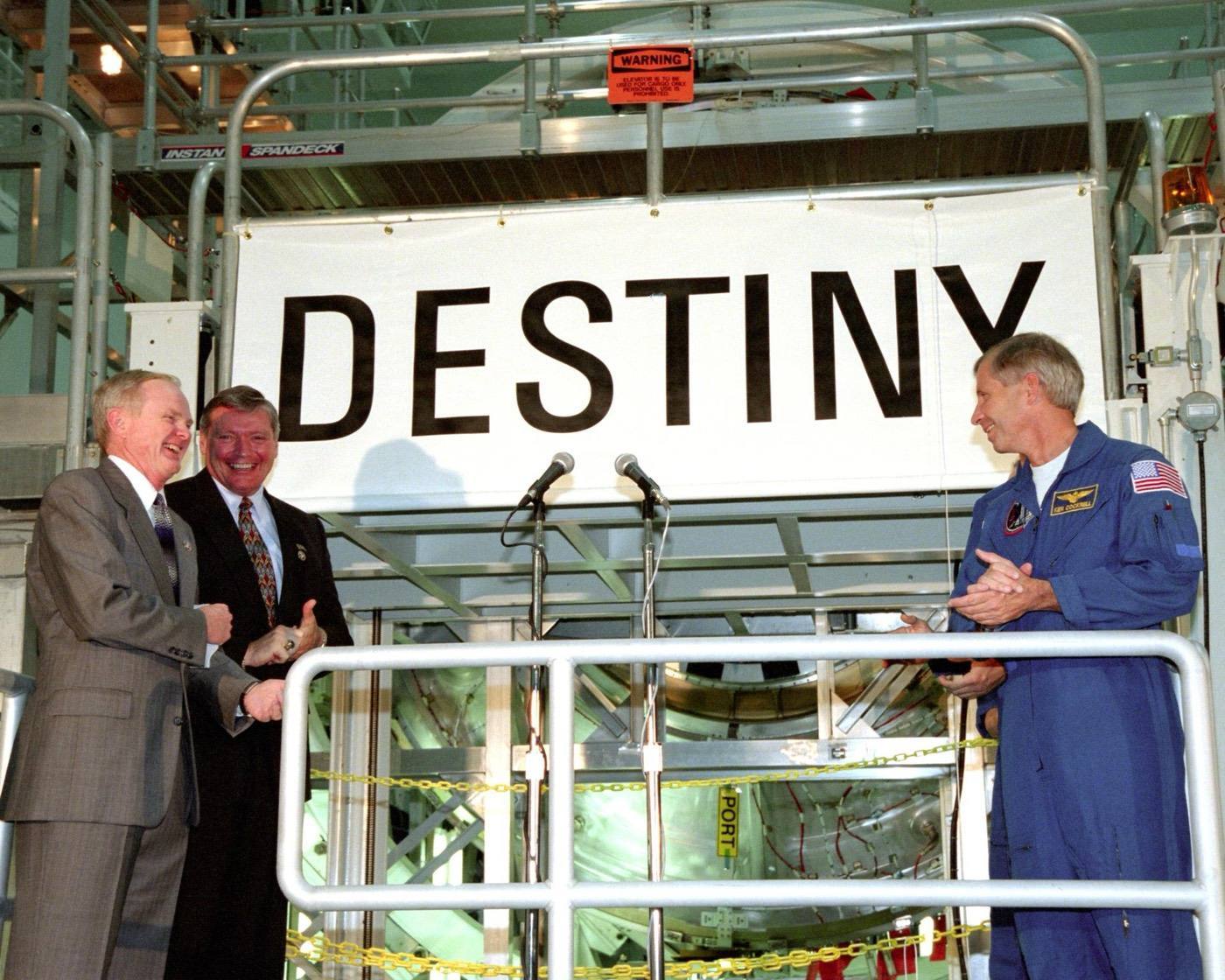 KENNEDY SPACE CENTER, FLA. - In the Space Station Processing Facility, Center Director Roy Bridges (left), Program Manager of the International Space Station (I