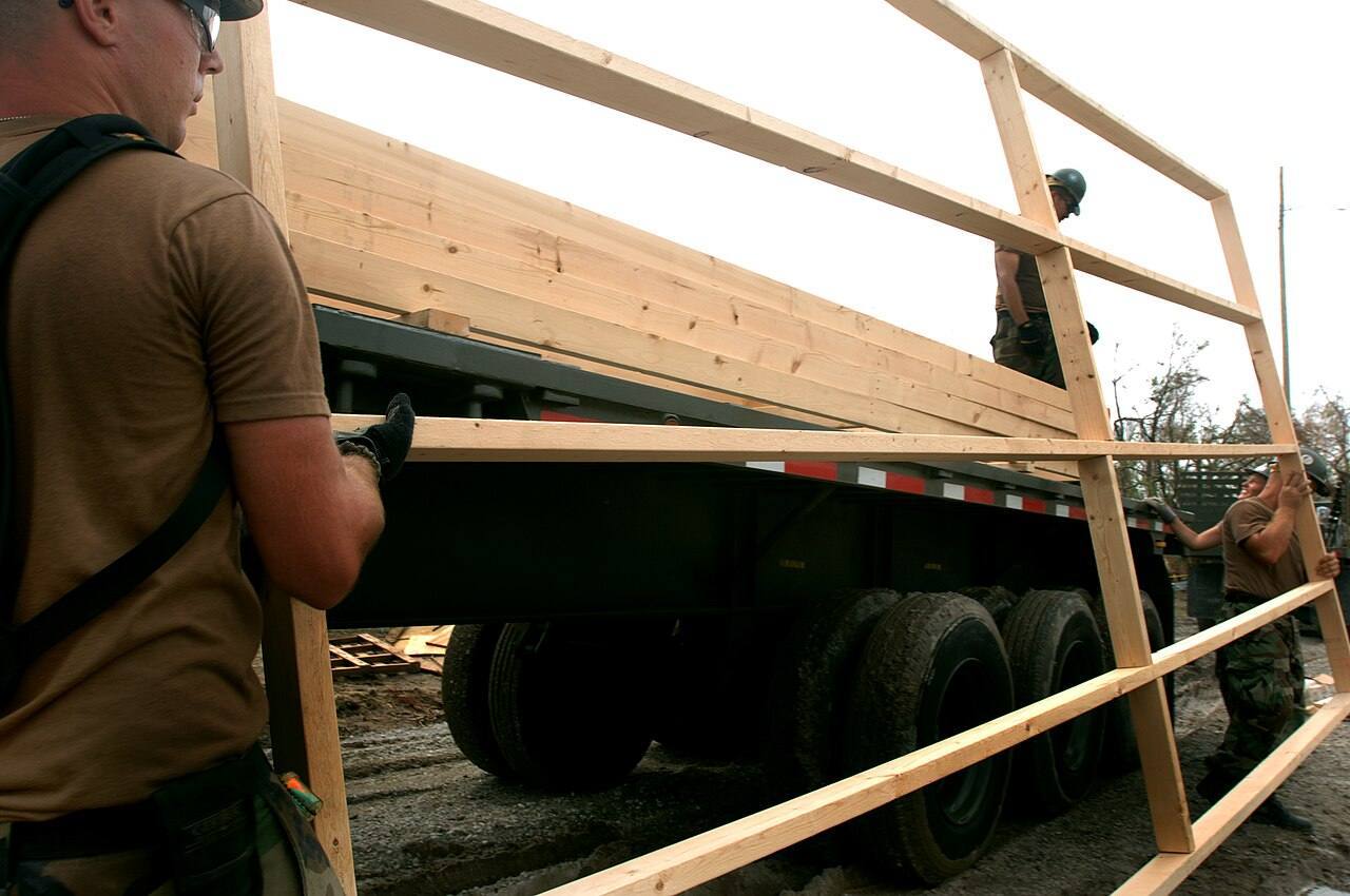 US Navy 050924-N-2653P-052 U.S. Navy Seabees, assigned to Naval Mobile Construction Battalion Four (NMCB-4), help assemble the foundation for the first of 75 te