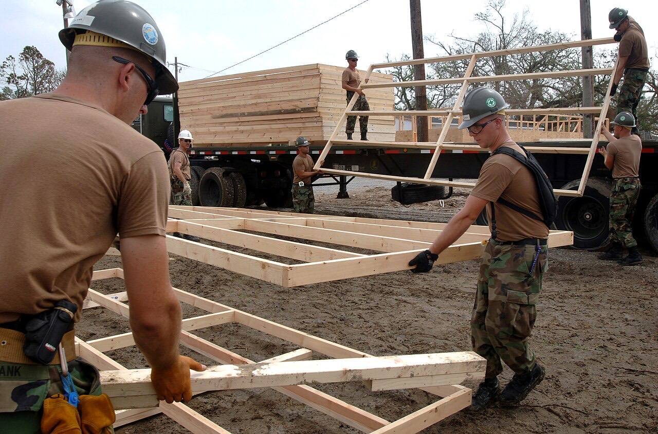 US Navy 050924-N-2653P-057 U.S. Navy Seabees, assigned to Naval Mobile Construction Battalion Four (NMCB-4), help assemble the foundation for the first of 75 te