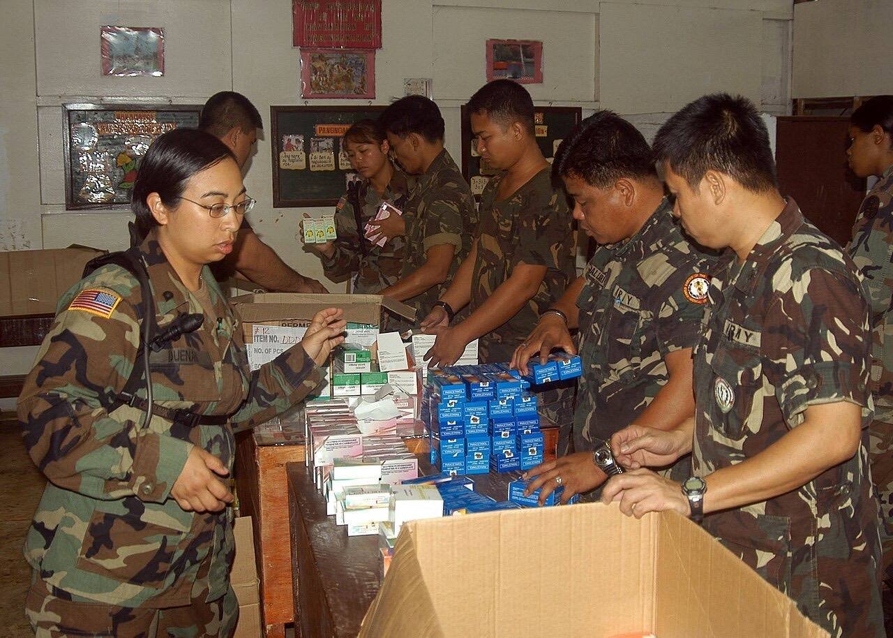 US Navy 050219-N-6775N-004 U.S. Army and Philippines medical personnel unpack pharmaceuticals in a school classroom prior to medical relief efforts during exerc