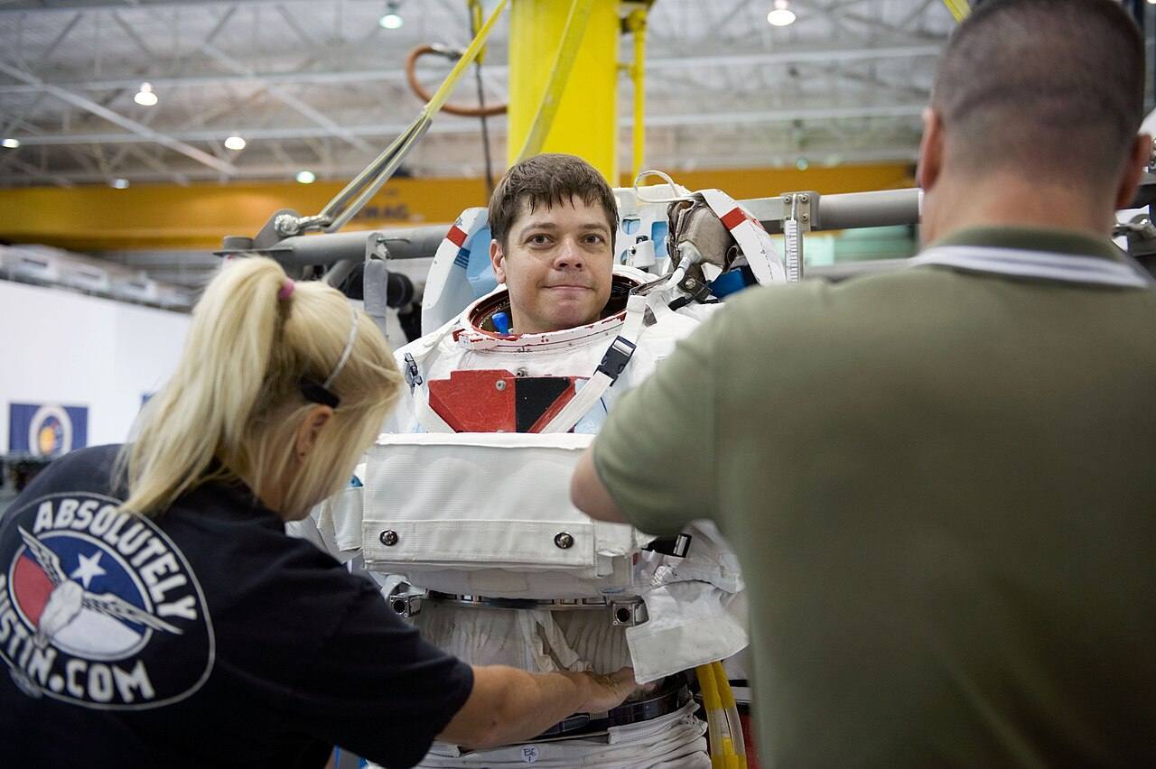 STS-130 training Behnken dons EMU 1
