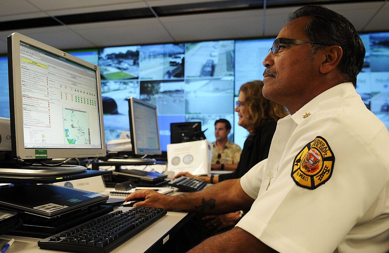 US Navy 110223-N-WP746-003 Wallace Mason, assistant chief of the Commander, Navy Region Hawaii Federal Fire Department, monitors a Solid Curtain-Ci