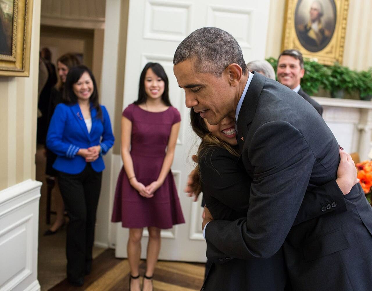 Barack Obama hugs Nina Pham, a Dallas nurse who survived Ebola, 2014