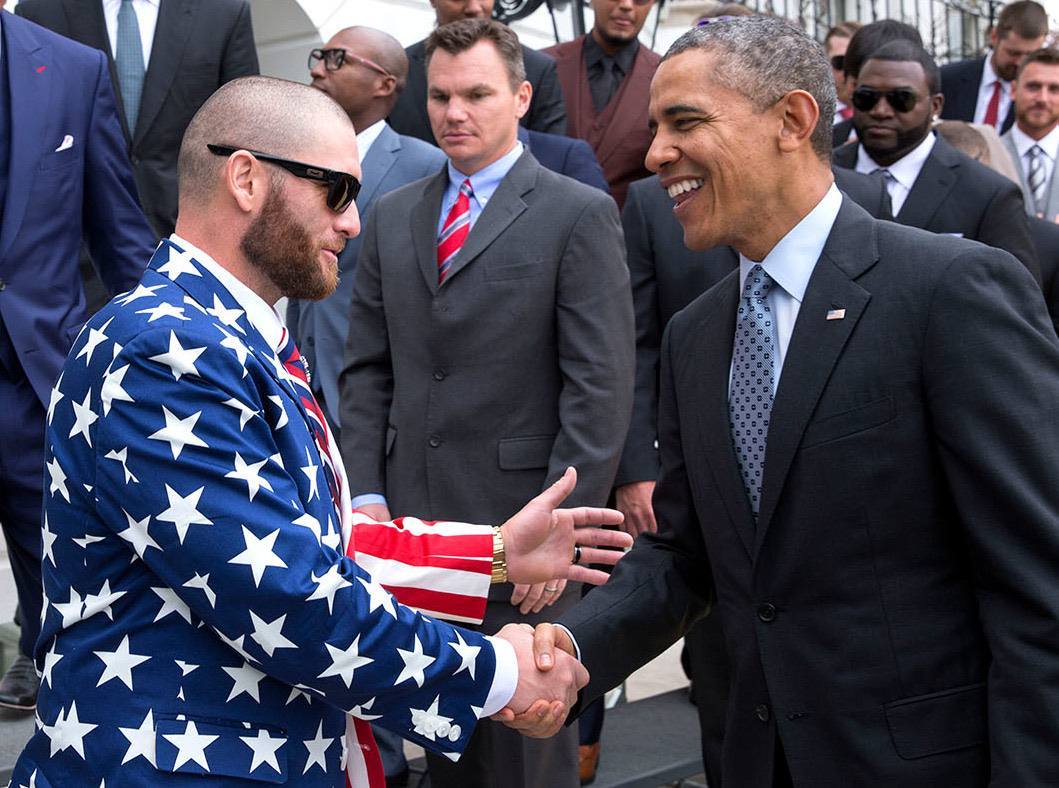 President Barack Obama greets Boston Red Sox outfielder Jonny Gomes during a White House event honoring the team and their 2013 World Series Championship, April