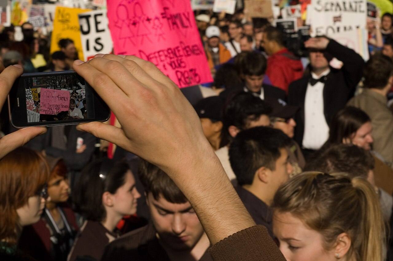 Photo of someone's smartphone screen capturing the en:November 15, 2008 anti-Proposition 8 protests in New York City.