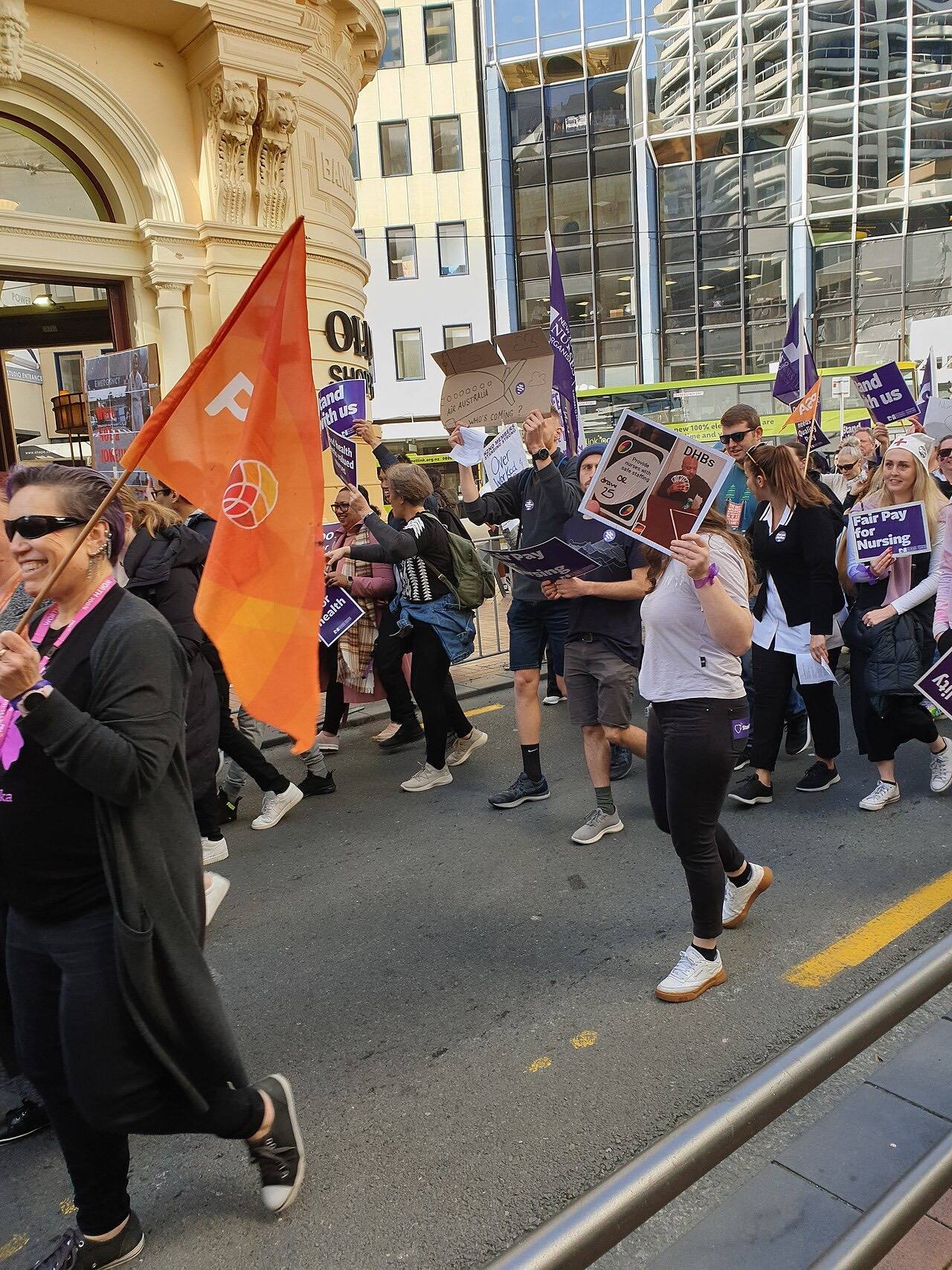 Striking nurses marching down Lambton Quay, Wellington