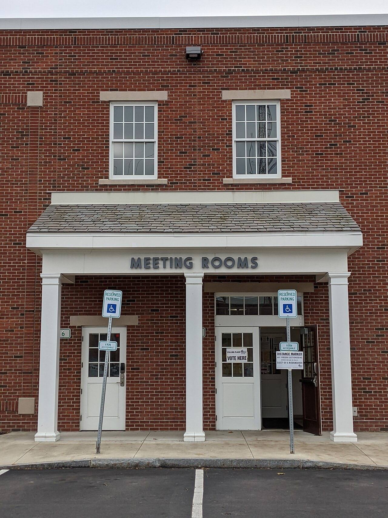 Entrance to polling place for the 2020 United States elections at Irondequoit, New York Public Library on election day. In contrast with early voting, there wer