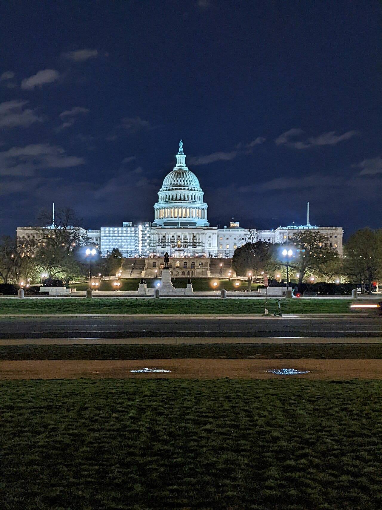 The United States Capitol Building at night, as seen from the National Mall.