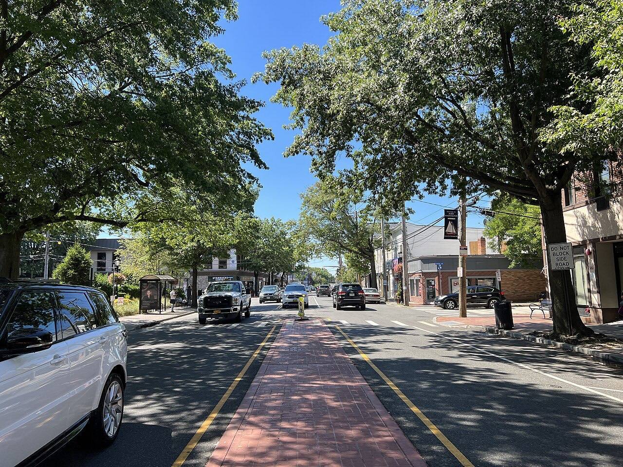 Main Street in Port Washington, NY on September 31, 2022, looking towards the west from just east of Herbert Avenue. Out of view to the left is the Port Washing