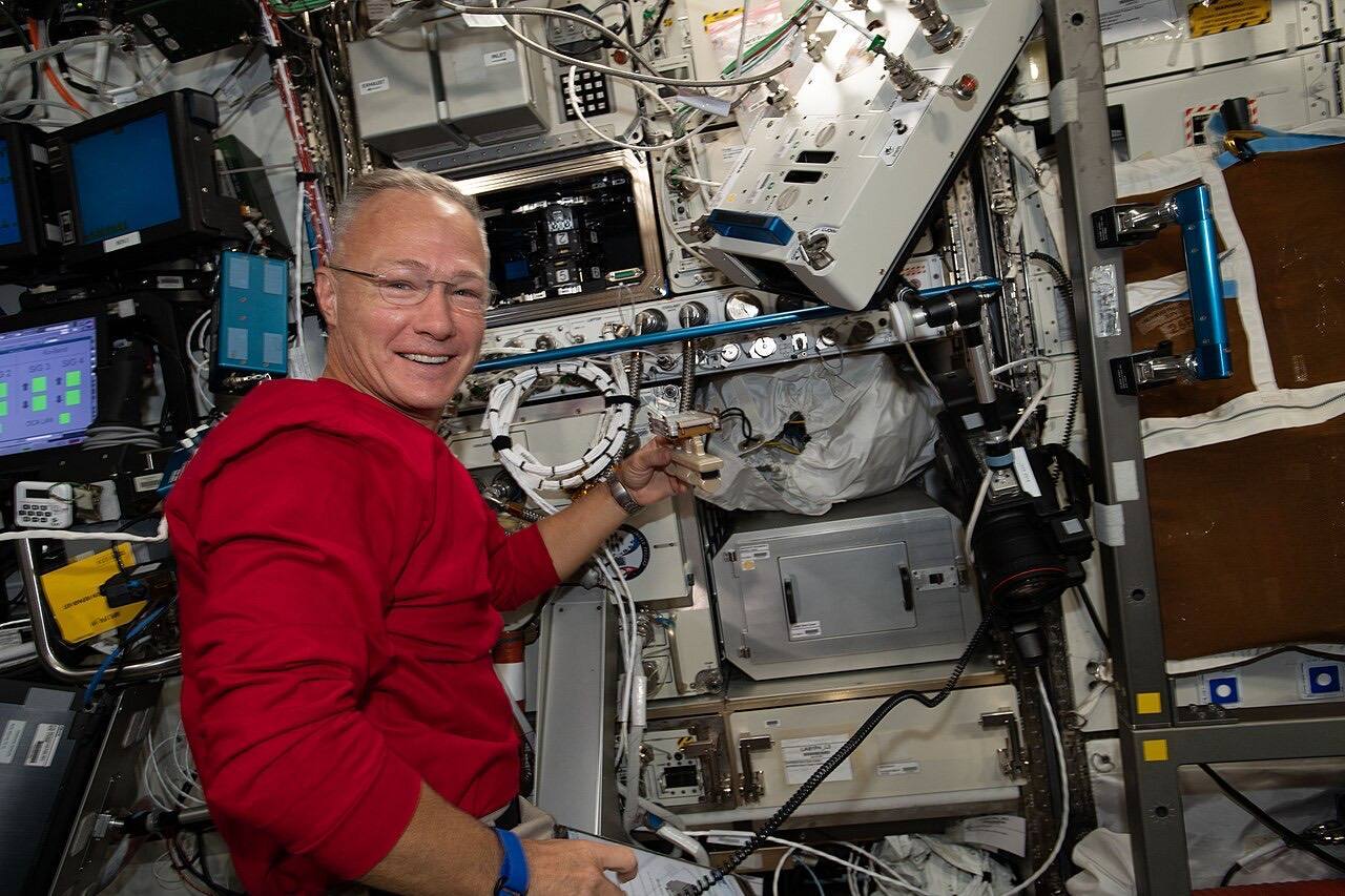 ISS 63 Hurley works on science hardware